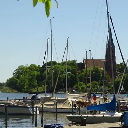 Gemuetliches Dachgeschoss-apartement Mit Seeblick Und Grossem Garten Am Wasser By Interhome